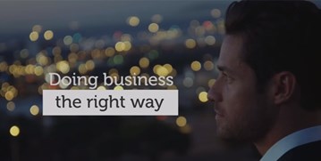 Man looking out over city lights, overlapped with the text "Doing business the right way."