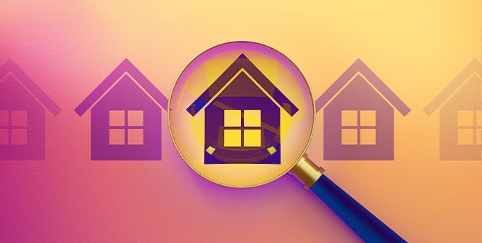 an image of a houses in line with a magnifying glass looking at one of the house